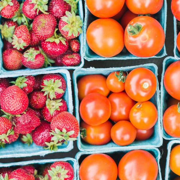 containers of tomatoes and strawberries