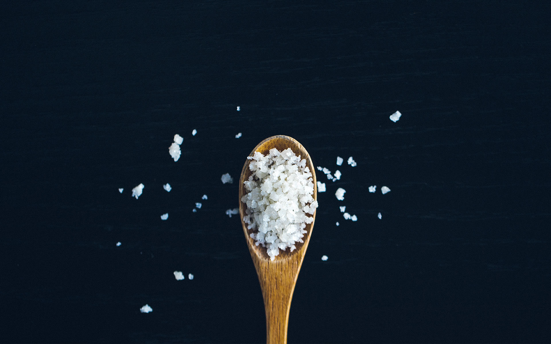 salt crystals on a wooden spoon