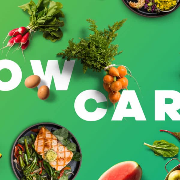 the words Low Carb on a green background surrounded by fruits and veggies