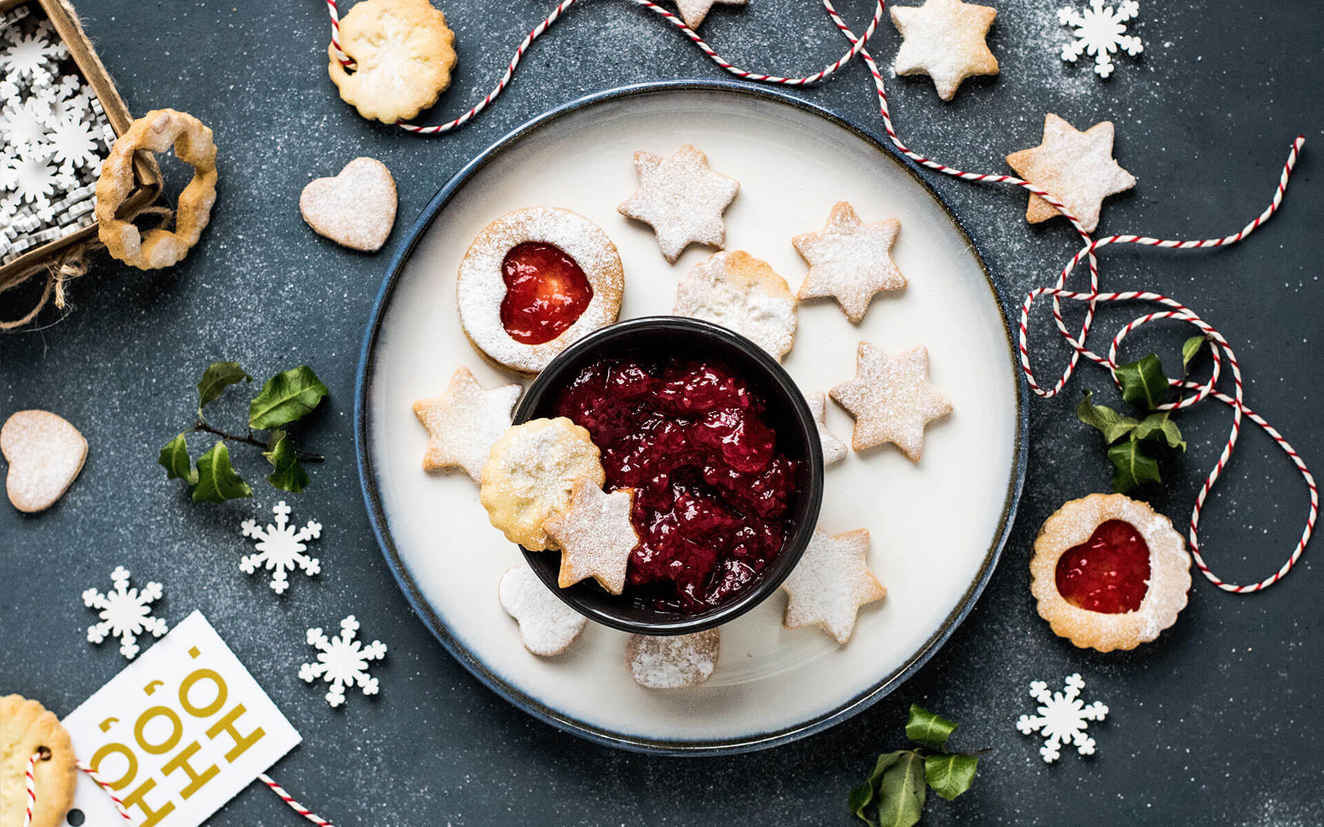 holiday cookies and jam on a dark background