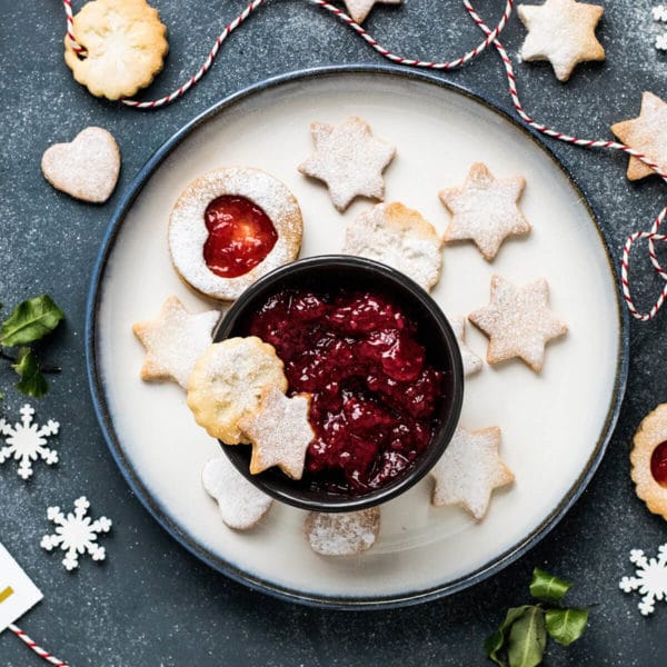 holiday cookies and jam on a dark background