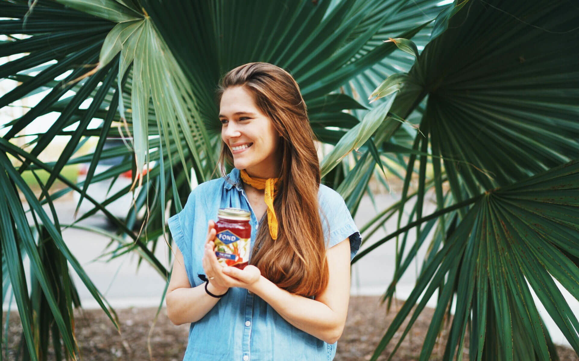 Alysa Seeland holding a jar of bone broth from her company