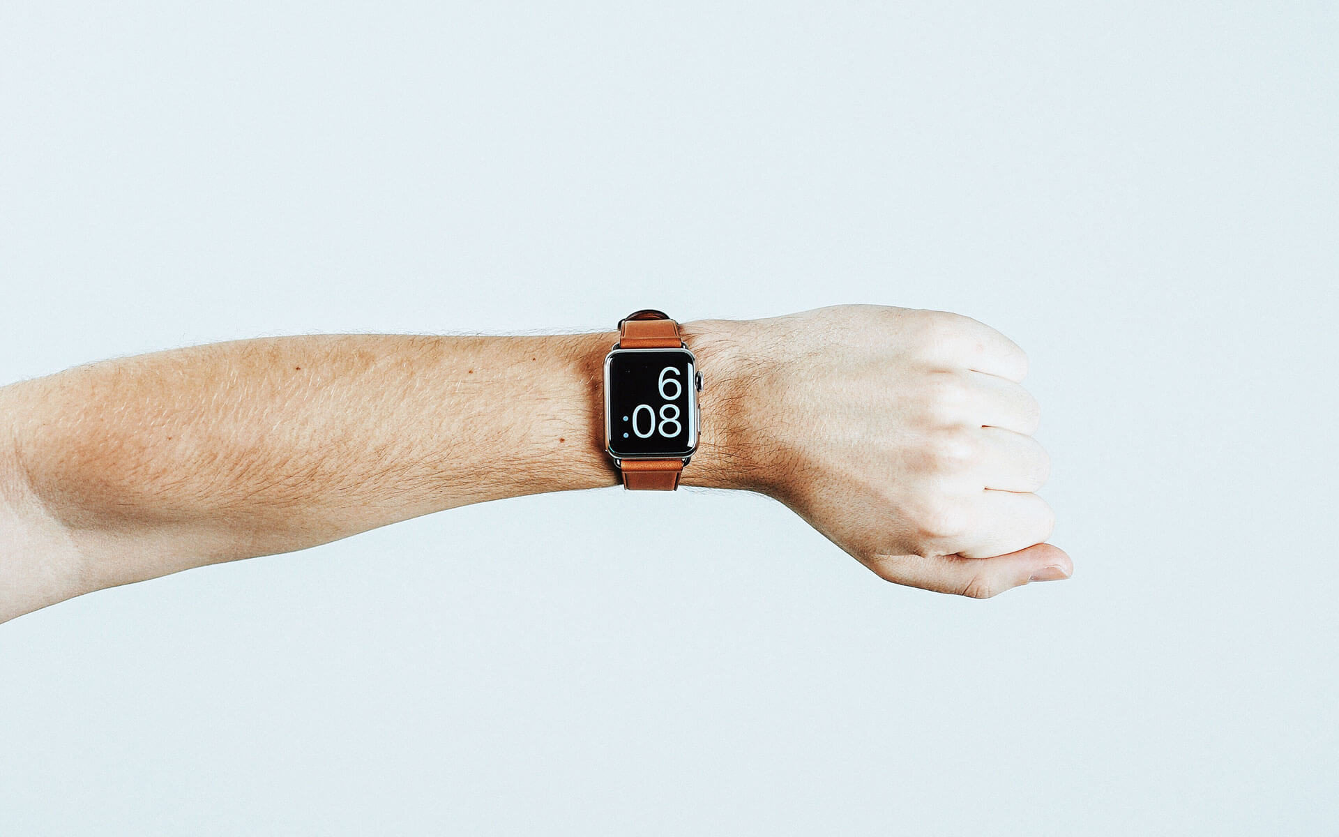a digital watch on someone's wrist