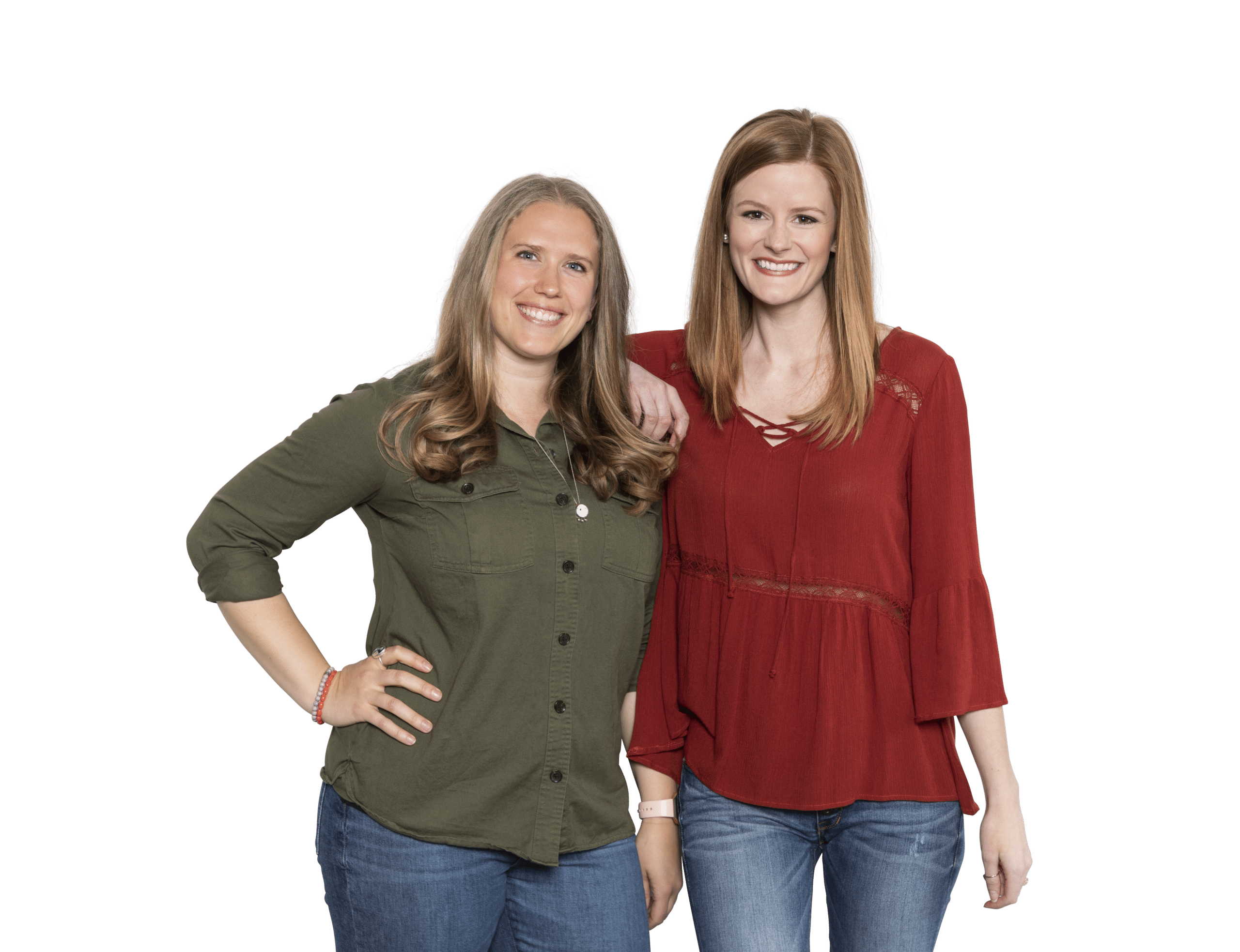 two women smiling on a plain background