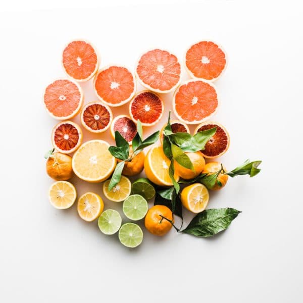 grapefruit, oranges and limes on a light background