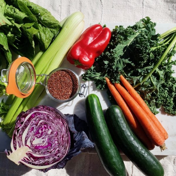 variety of fresh veggies including cucumbers, carrots, kale and raddichio