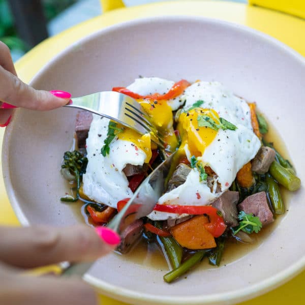 poached egg on steak and veggies