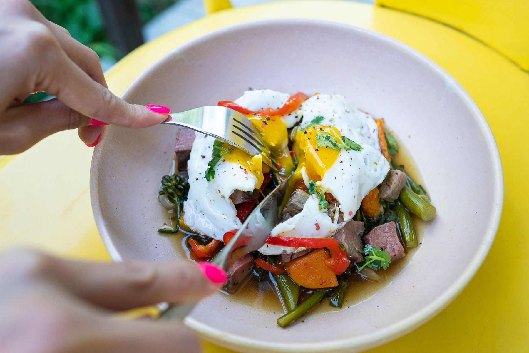 poached egg on steak and veggies