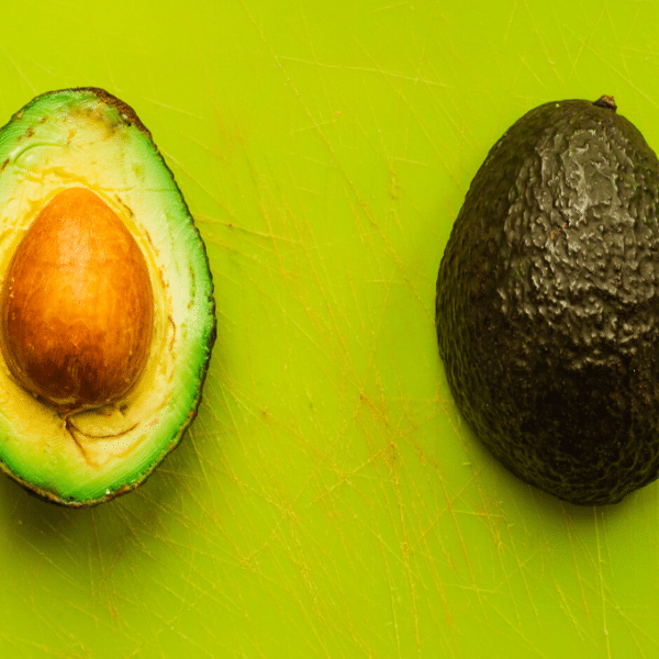 avocado halves on a green background