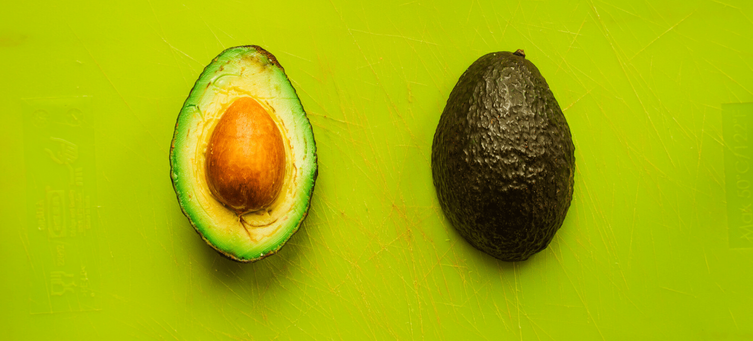 avocado halves on a green background