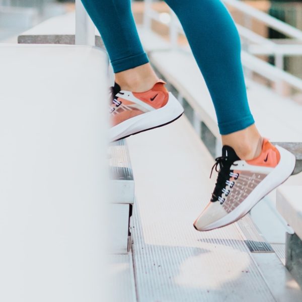 close up of runner's feet on steps