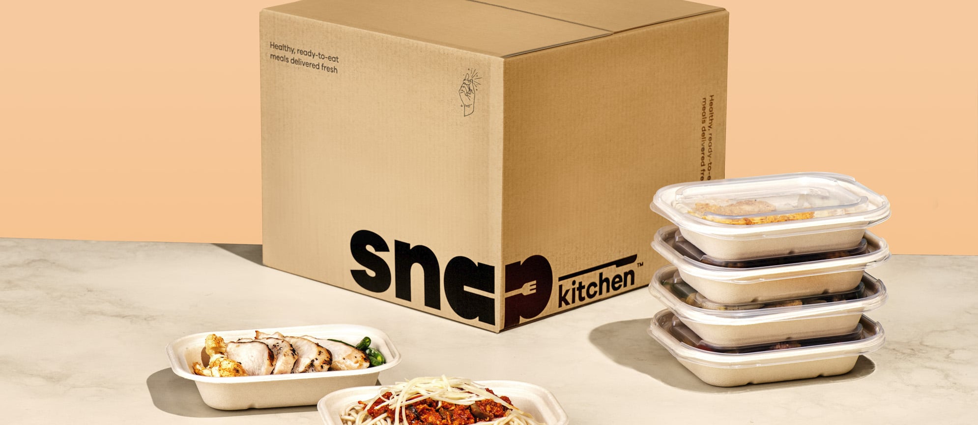 Cardboard box with snapkitchen meals