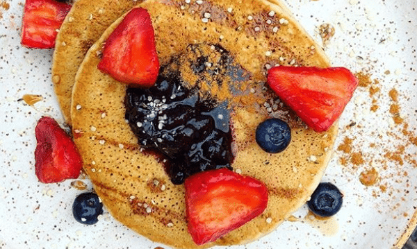 Banana pancakes with blueberries and strawberries