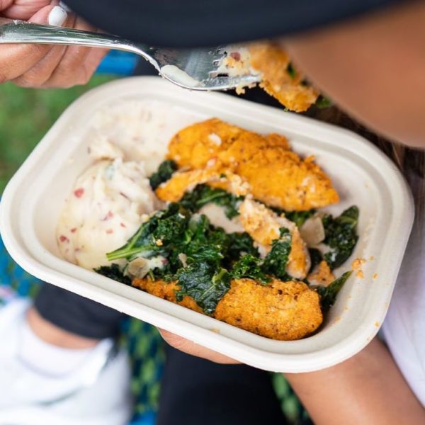 Close up of someone eating Snap Kitchen's chicken tender turnip mash