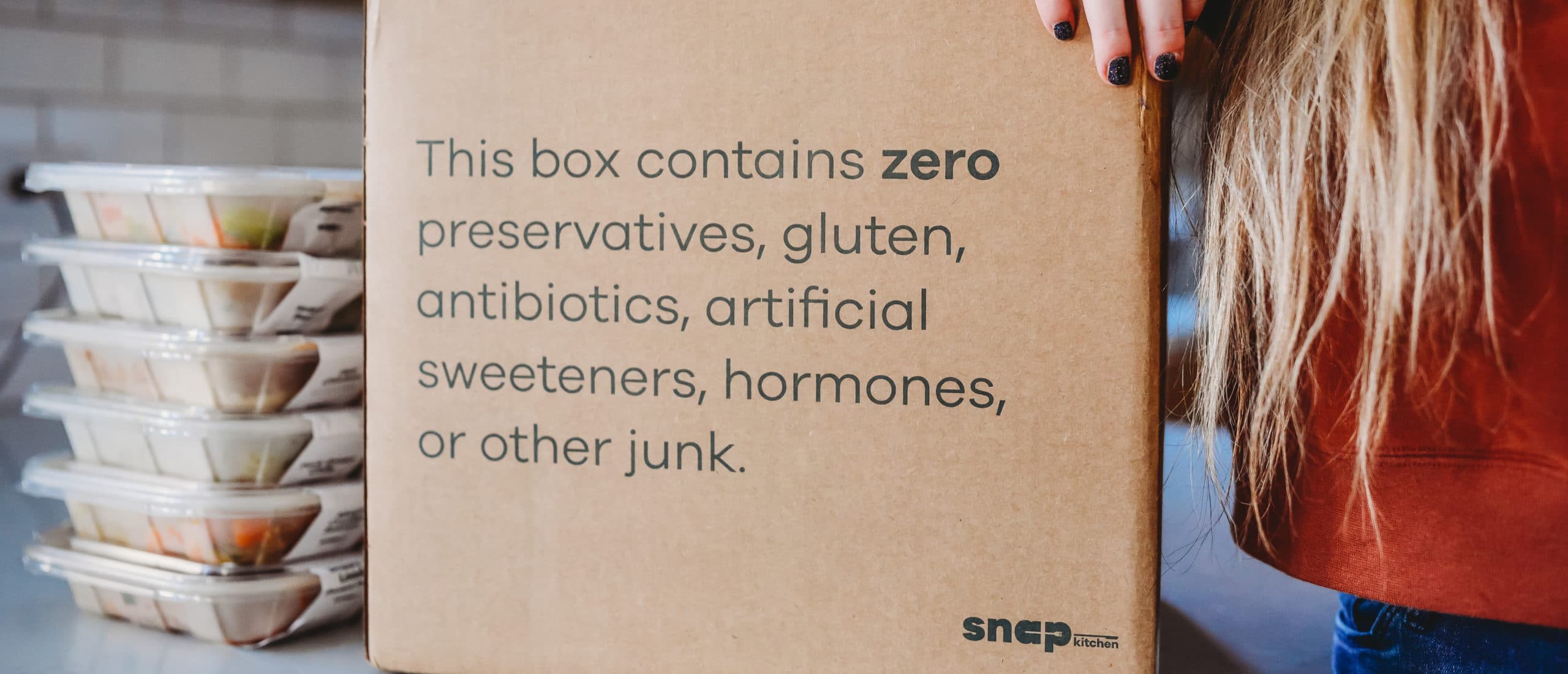 Snap Kitchen shipping box printed with the words 