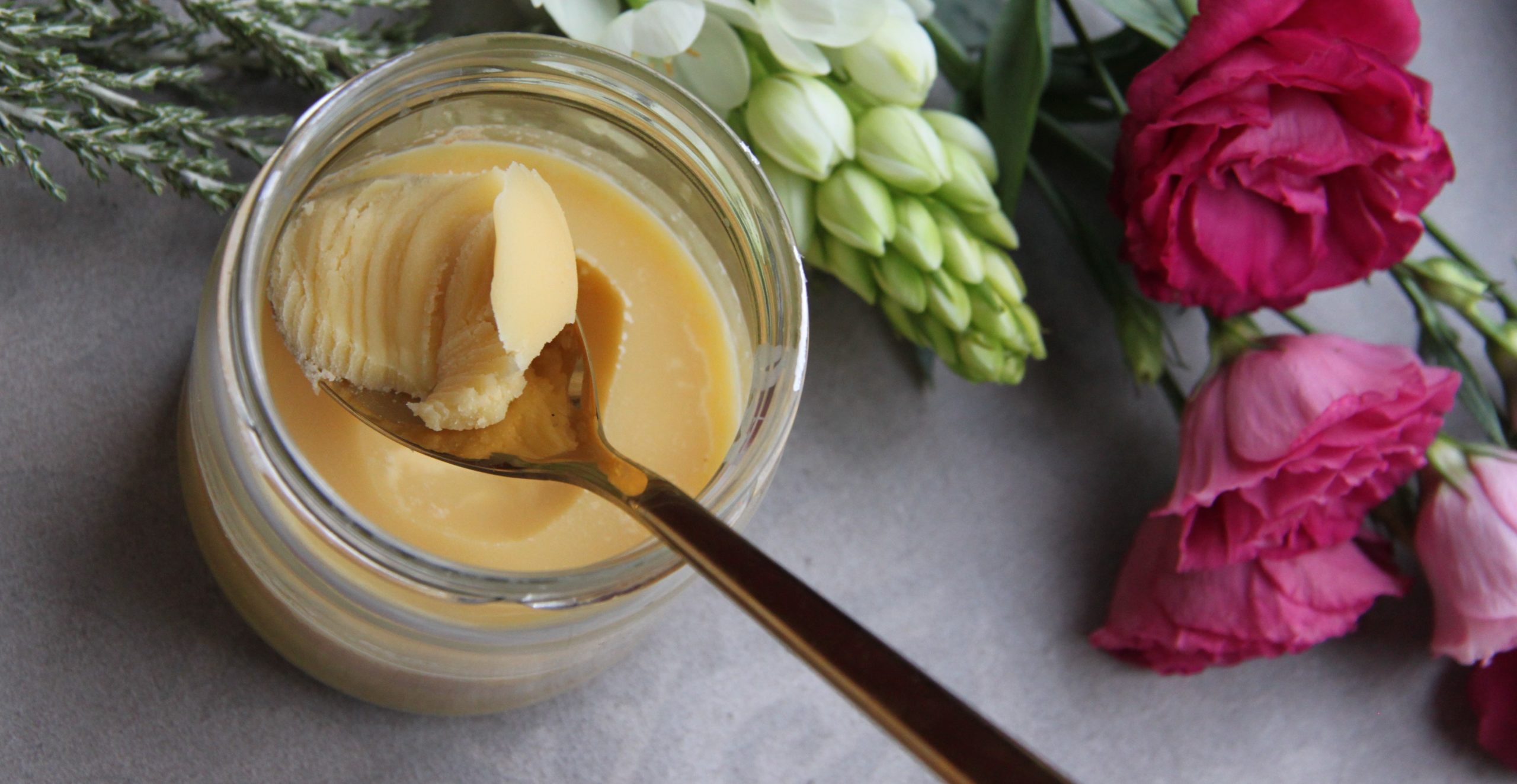 Close up of a spoon in a jar of Ghee