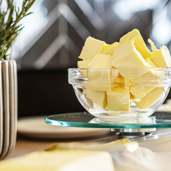 Bowl of chunks of butter sitting on a glass burner
