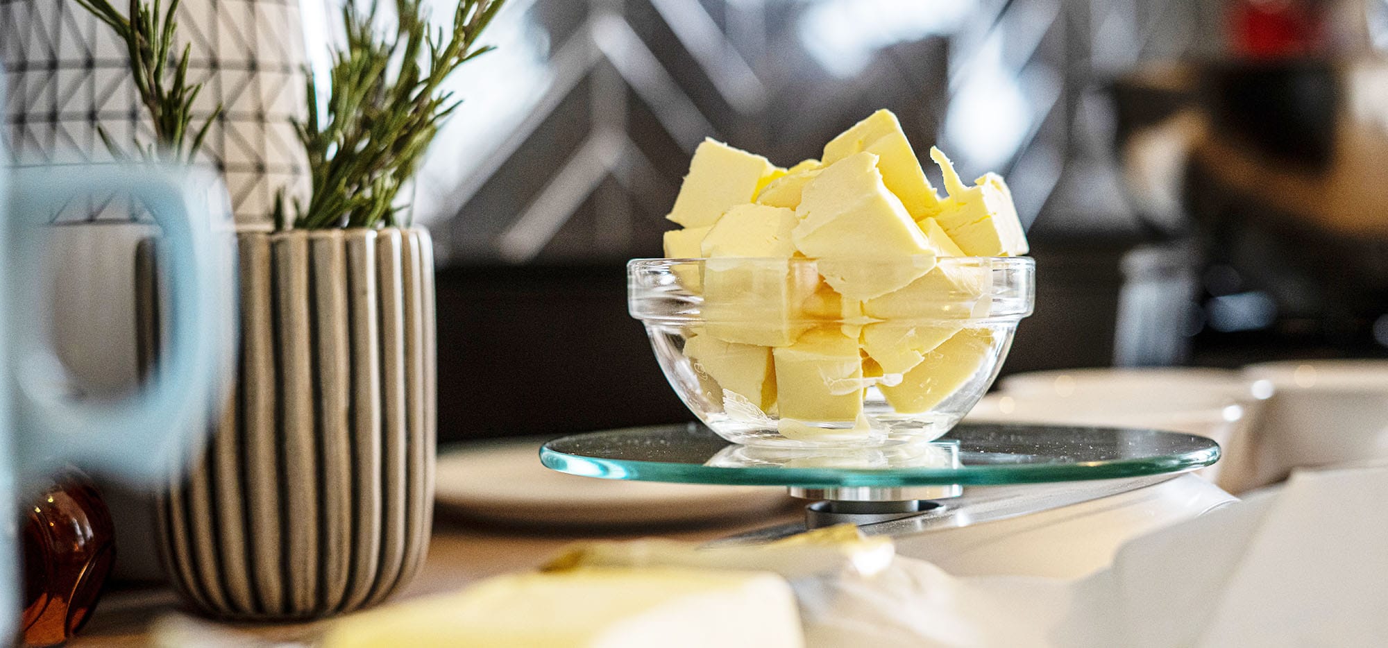 Bowl of chunks of butter sitting on a glass burner
