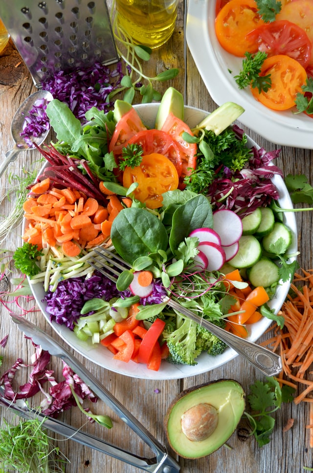 salad with a variety of vegetables including carrots, peppers, spinach, and more
