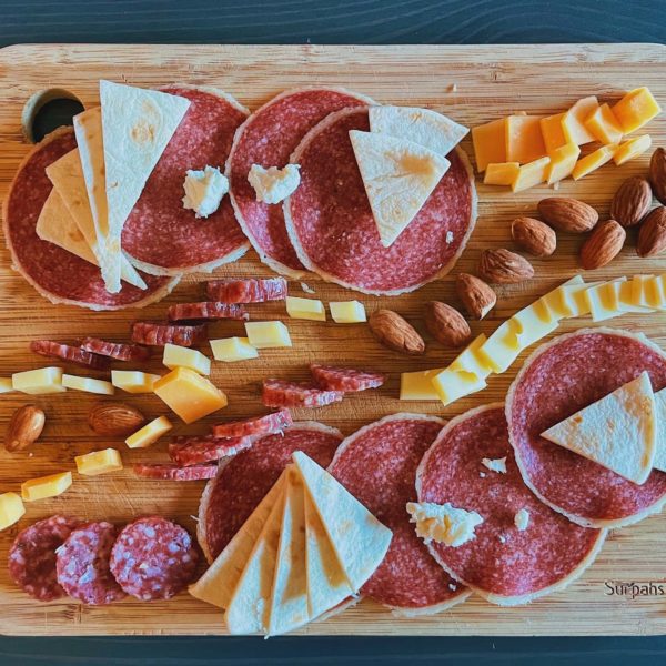 cured meat on a wooden cutting board