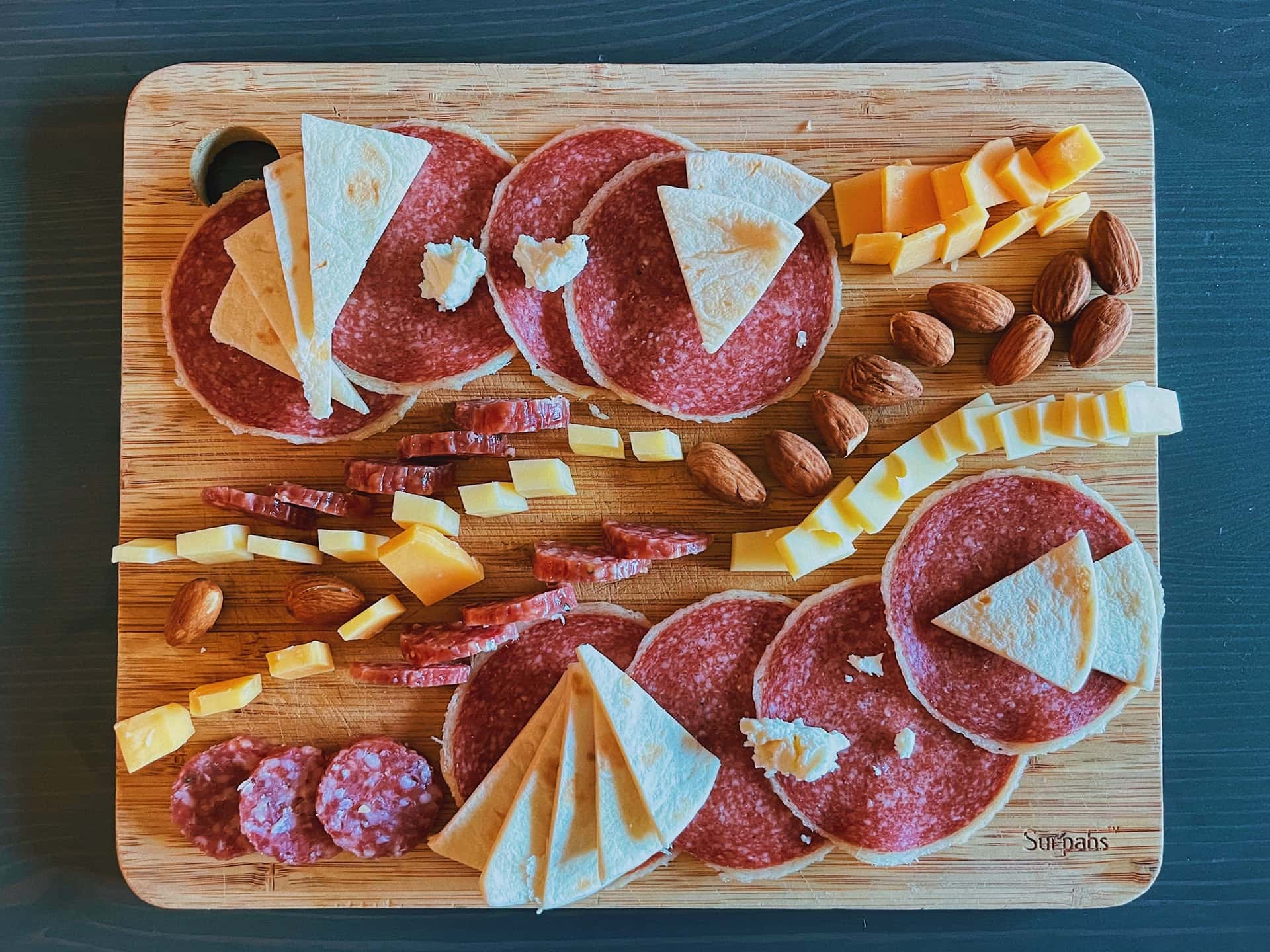 cured meat on a wooden cutting board