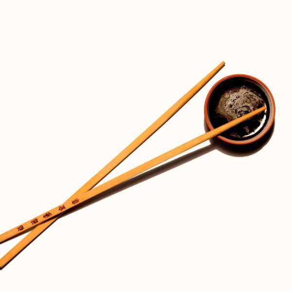 soy sauce with wooden chopsticks