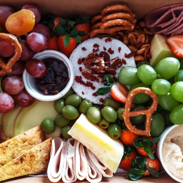 Various snacks such as cheese, grapes, pretzels, and more